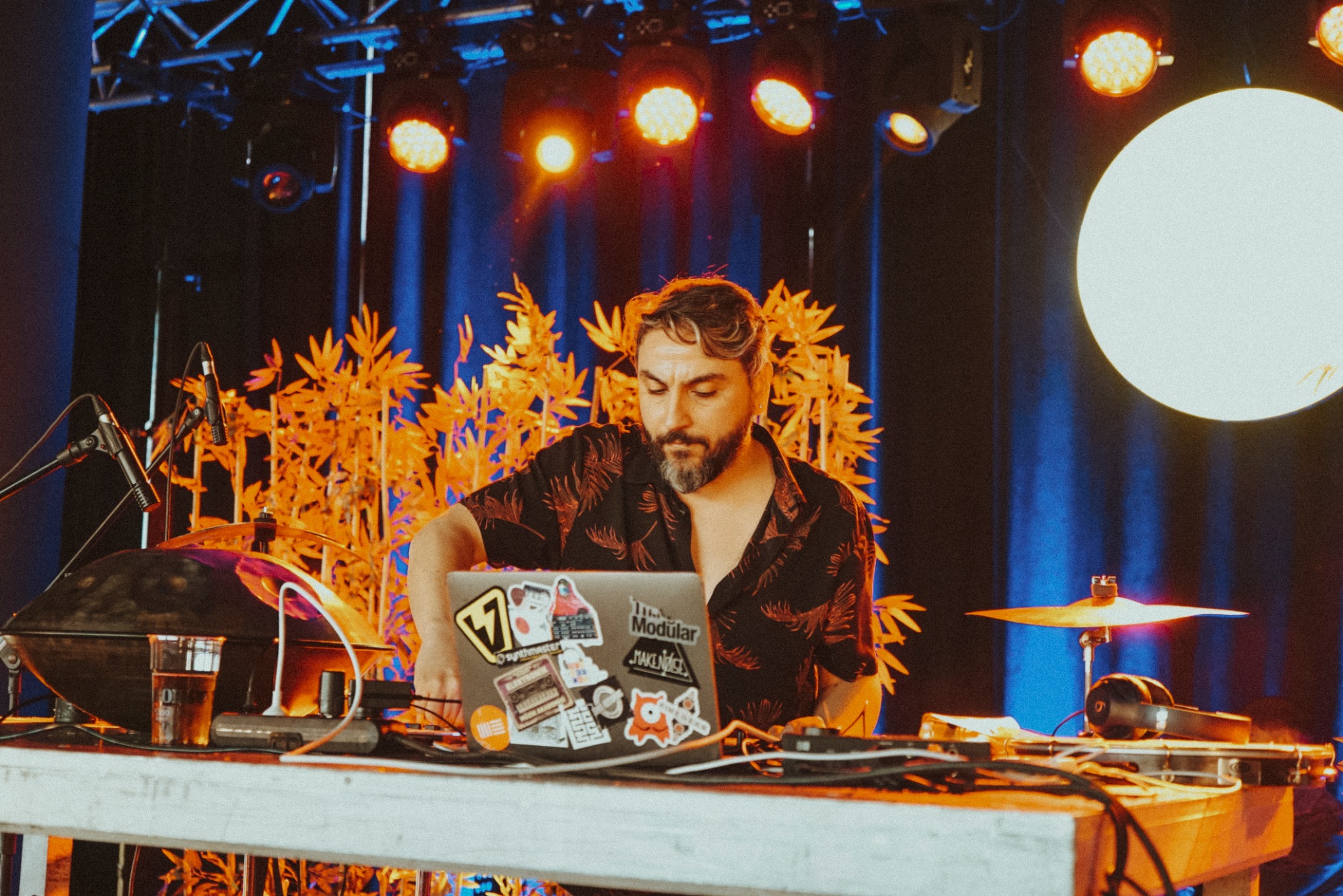 Gerçek Dorman performing with laptop, percussion and electronic setup